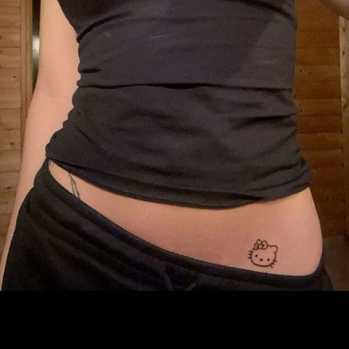 Small Kitty Tattoo On Side Belly